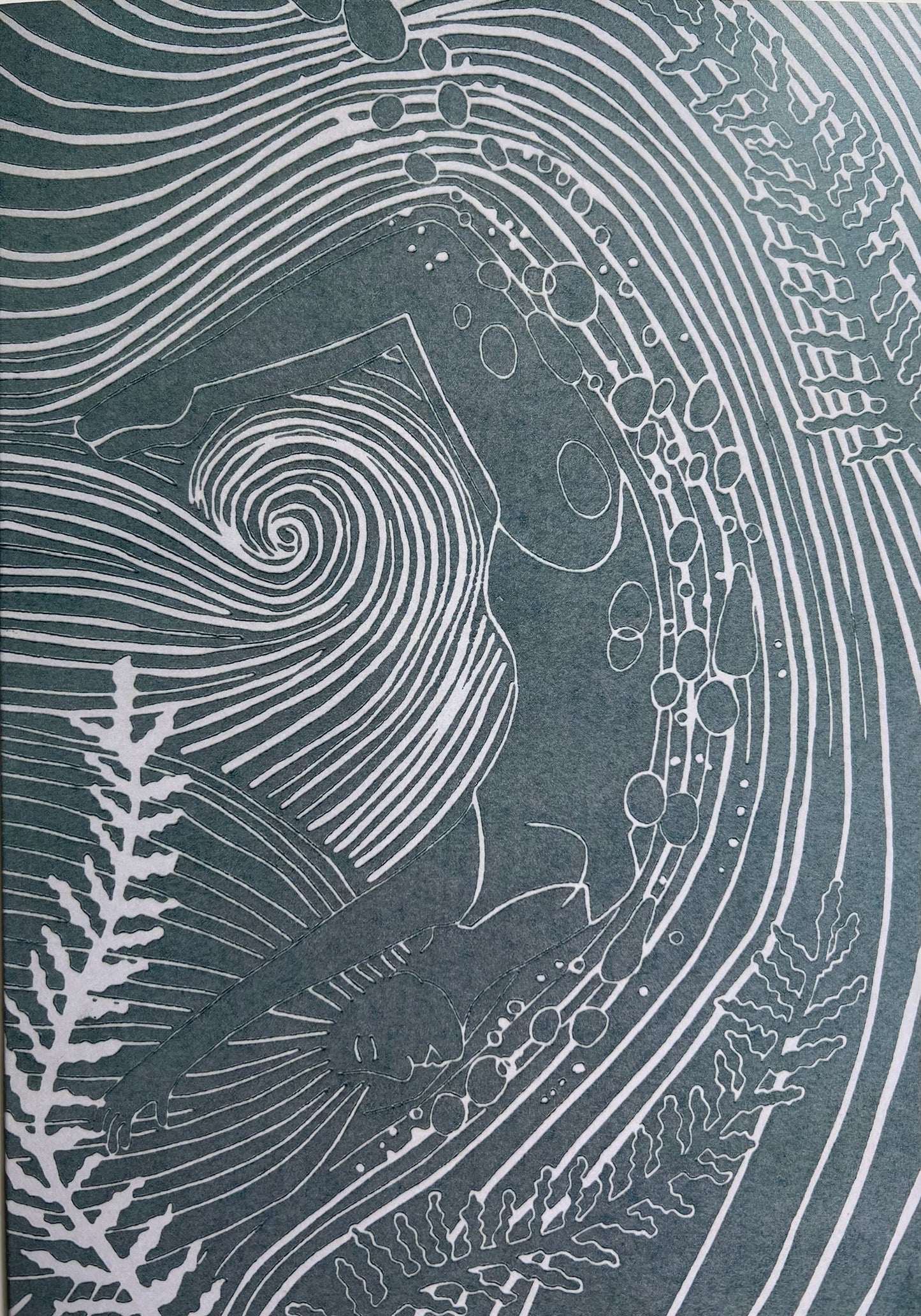 A greetings card featuring a central female swimmer with seaweed and surrounded by abstract, curly lines on a light silvery blue background.