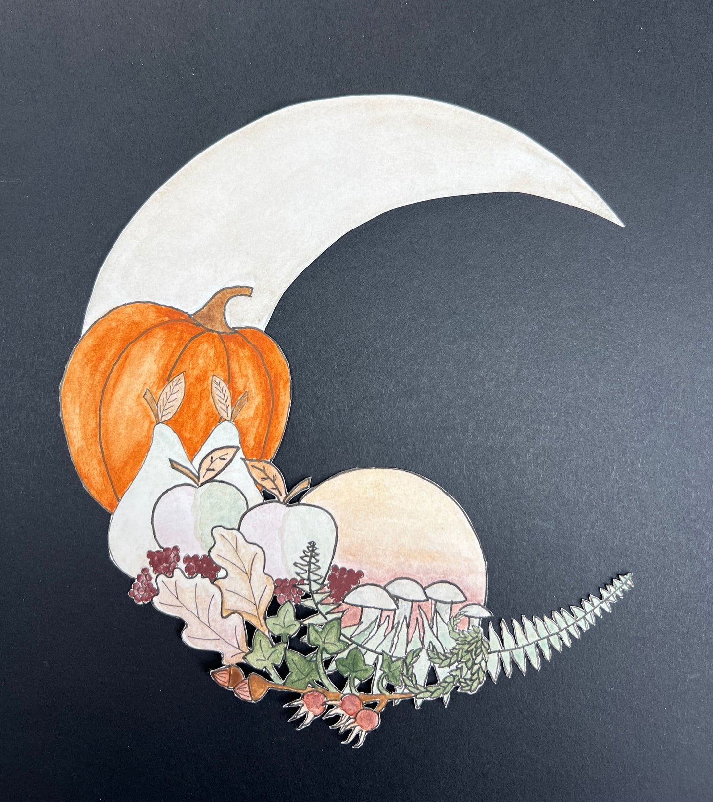 Decorative design with a white crescent moon, orange pumpkin, and autumn leaves on a dark background